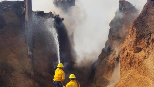 2MCFire crew working to stop ignited section of almond shell pile from extending to unburned sections, which would have caused complete loss. We were able to save  pile.